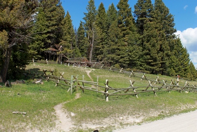 Simple wooden grave markers in the back corner of the fenced-in area pay a humble tribute to the five miners buried at the Sand Park Cemetery (shown above) between 1898 and 1914.