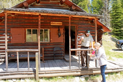 Diana speaks with a BLM volunteer at the staff office cabin.  Having been built in 1949, the Bill Hbner cabin is one of the better preserved cabins in Garnet.  For staff only... do not enter.