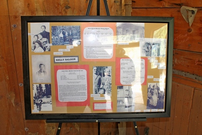 Poster with pictures describing the story of Louis P. Kelley and Sarah Ann McLeod, owners of the property housing Kelley's Saloon.