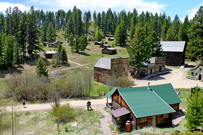 Overview of most structures seen upon entering Garnet (ghost town) by foot from the parking lot.  In the foreground was the remodeled home of Ole and Marion Dahl who moved there in 1938.  They built their own saloon, Dahl's Bar, just down the street.  This cabin can be rented in the winter.
