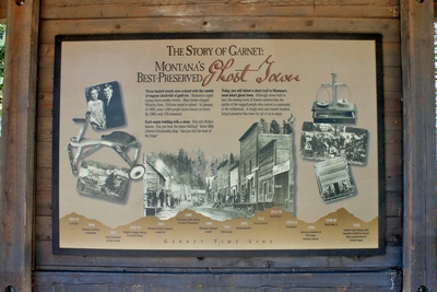 Sign just off the parking lot. The Story of Garnet, Montana's Best Preserved Ghost Town. Follow a short trail to Montana's most intact ghost town.  This sign shows an interesting picture of what Garnet really looked like at the turn of the century.